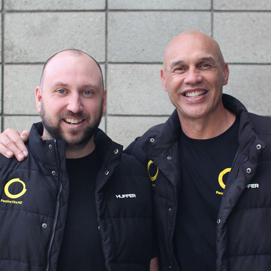 Awen Guttenbeil and Joe Pope of Passive Fire NZ celebrating team milestones and leadership transition.
