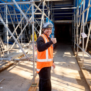 Smiling worker giving a thumbs-up after completing a passive fire inspection